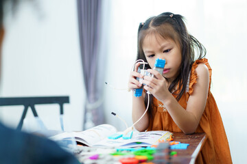 Group of diverse children enjoy learning about the STEM.