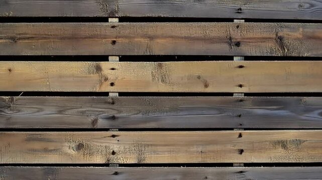 Rustic weathered wooden pallet background with visible wood grain and nails, creating a textured surface perfect for backgrounds