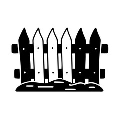 Stylized black and white fence with decorative posts set in a garden