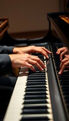 Obraz premium two hands on a piano keyboard with a person's hand resting on the piano