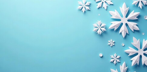 Close-up of beautifully cut paper snowflakes on a soft blue backdrop, seasonal, festive, DIY