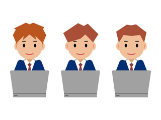 パソコンを操作する紺色スーツの若い男性