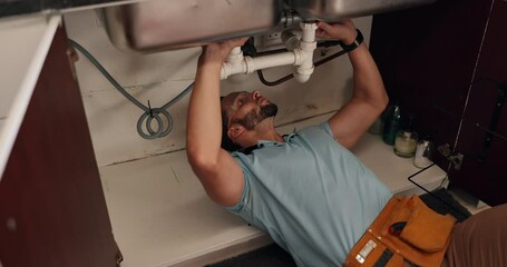 Fixing, maintenance and repair with handyman in kitchen of home for upgrade of pipes or water flow. DIY, labor and plumbing with plumber in apartment for evaluation, renovation or service of system