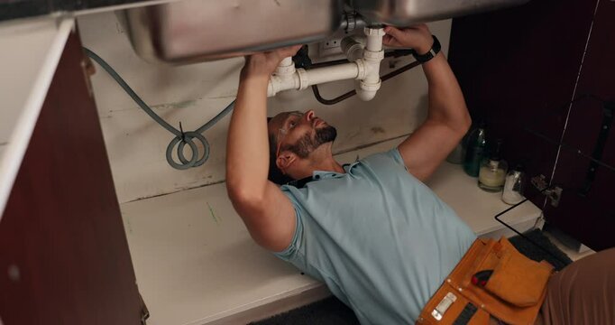 Fixing, maintenance and repair with handyman in kitchen of home for upgrade of pipes or water flow. DIY, labor and plumbing with plumber in apartment for evaluation, renovation or service of system