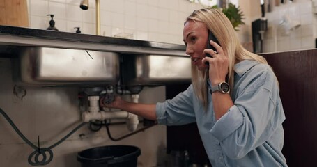 Leak, phone call and pipes with woman in kitchen of home for assistance, help or service. Communication, emergency and plumbing with person in apartment for conversation, maintenance or repair