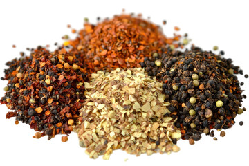 A vibrant array of crushed spices with varying hues of brown, red, and beige in a pile