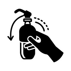 Hand using a pump dispenser bottle to dispense liquid soap or lotion