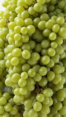 A large cluster of vibrant green grapes isolated on white , healthy, summer, food