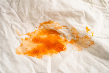 Dirty tomato sauce stain or ketchup on cloth to wash with washing powder, cleaning housework.
