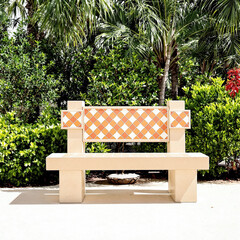 tranquil outdoor bench with an orange and white diamond tile backrest surrounded by lush green tropical foliage
