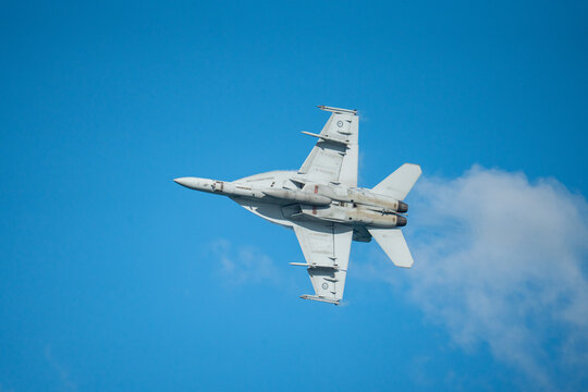 F18 Super Hornet performing maneuvers in the sky