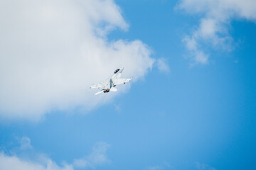 F18 Super Hornet performing maneuvers in the sky