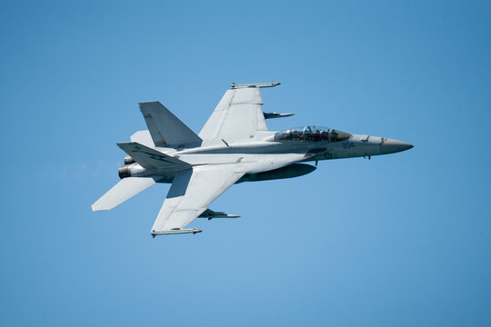 F18 Super Hornet performing maneuvers in the sky