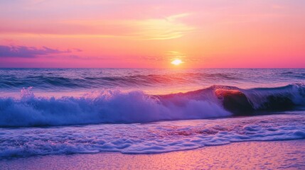 A sunset over the ocean with hues of pink, orange, and purple reflecting on the waves.