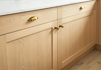 light oak kitchen cabinets with gold hardware