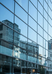 Obraz premium reflective glass facade of a modern city building
