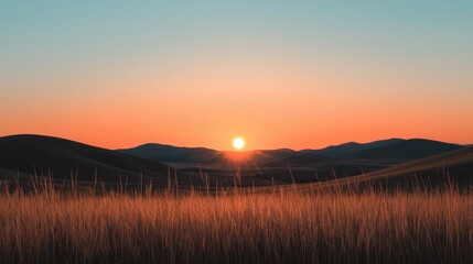 Obraz premium The sun is setting behind the distant rolling mountain landscape