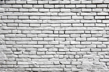 Obraz premium Distressed and Weathered White Brick Wall Providing a Timeless Architectural Texture