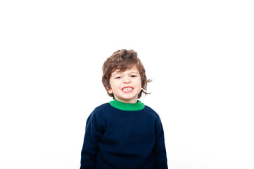 little boy with his finger on his mouth