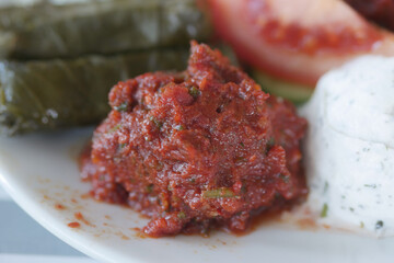 Freshly made spicy tomato dip served with traditional sides