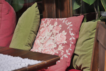 Cozy outdoor seating area with colorful cushions in a garden setting