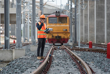 Engineer Inspecting Railway Track During Construction