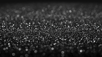 Shimmering black glitter dust creates magical atmosphere