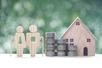 Mutual fund,Love couple senior and model house on natural green background, Save money for prepare...