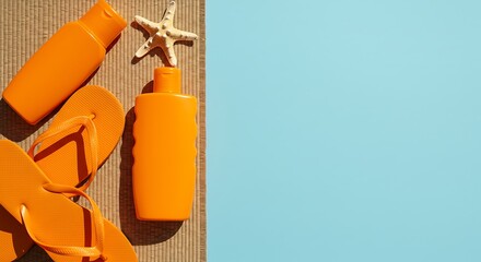 Summer essentials: sunblock, flip-flops and starfish on a sunny day