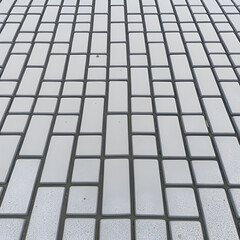 Gray paving stones. Paving surface road. Texture made of big gray cement bricks. Brick stone street road - pavement texture effect