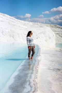 Woman tourist enjoying the Pamukkale thermal pools in Turkey