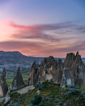 Cappadocia rock formations glowing during colorful sunset