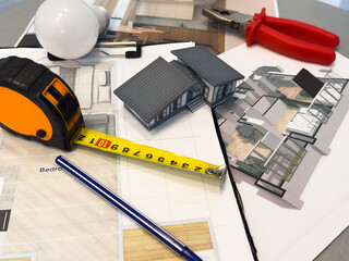 Architect workplace top view. Architectural project, blueprints, blueprint rolls on table....