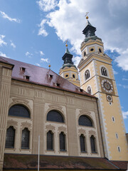 Historic Architecture of Bressanone Baroque Cathedral and Towers Against Blue Sky, Italy
