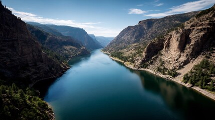 Colorado's serene valley: A calm river flows between steep canyon walls