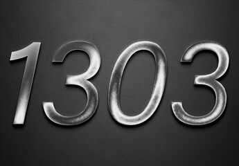 Chrome metal 3D number design of 1303 on grey background.