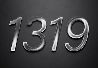 Chrome metal 3D number design of 1319 on grey background.