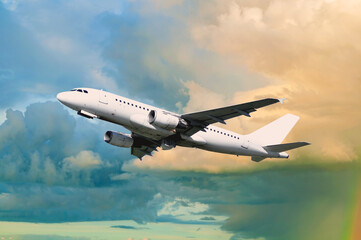 Airplane flying, travel by air concept, airplane in the flight, white commercial airplane flying in the sky among the clouds