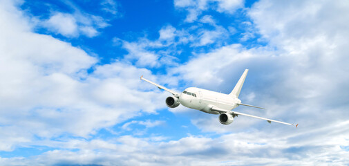 Airplane flying, picturesque travel background with white airplane in the sky