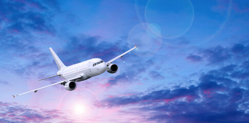 Airplane flying in the sky, travel background with white commercial airplane in the flight