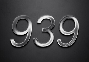 Chrome metal 3D number design of 939 on grey background.