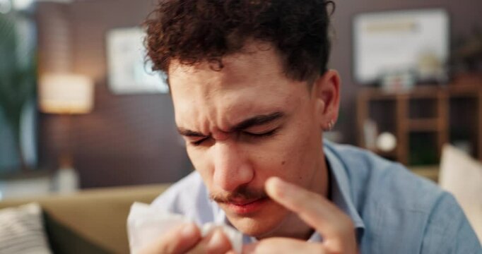 Sick man, sneeze and blowing nose with tissue for illness, influenza or viral infection at home. Male person, bacteria or germs with hayfever, sinus or allergies for cold, flu or disease at house