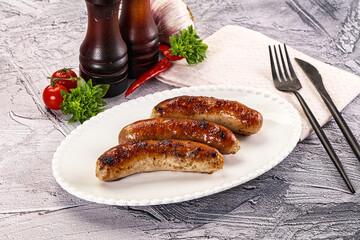 Delicous natural roasted sausages in the plate