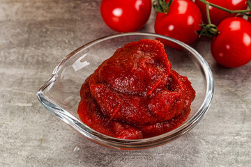 Red tomato paste in the bowl