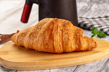 Fresh hot homemade croissant for breakfast
