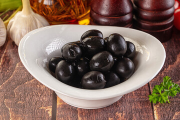 Mediterranean marinated Black olives in the bowl