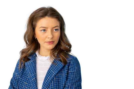 Professional businesswoman in blue jacket glancing sideways against transparent backdrop