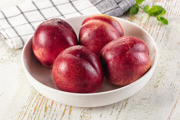 Ripe sweet juicy nectarines heap