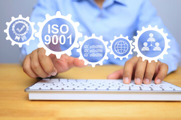iso 9001 quality management system concept with businessman pointing on process system icon to...