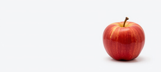 Crimson Delight: A single, vibrant red apple stands in splendid isolation. Its crisp, shiny skin and elegant stem invite a sensory experience of fresh fruit
